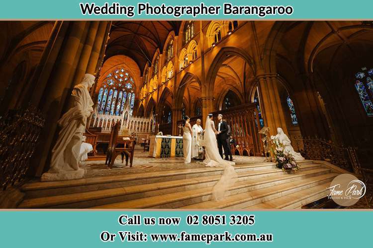 Bride and Groom at the Altar With the Priest barangaroo