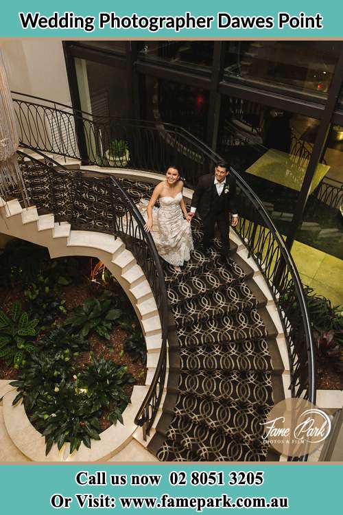 Bride ang Groom Walking down the stairs Dawes Point NSW 2000