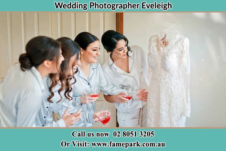 Bride looking at the wedding gown Eveleigh