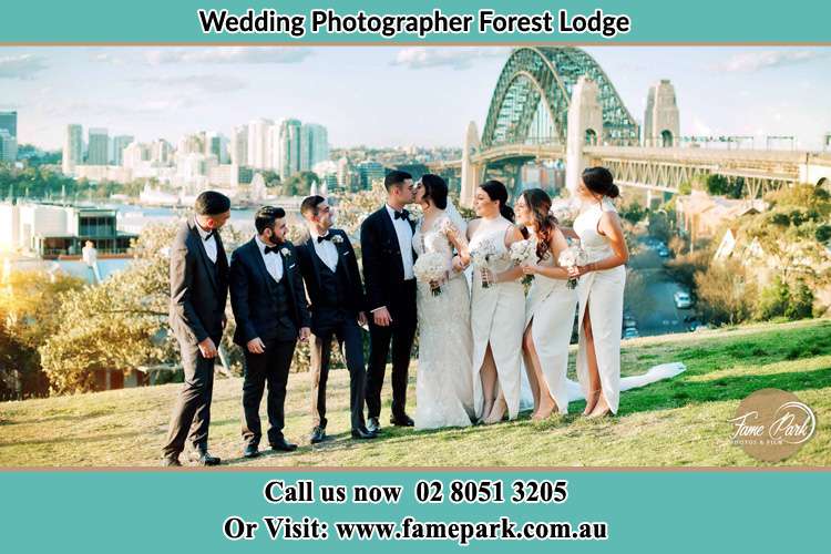 The bride and Groom at the hill with their secondary sponsor Forest Lodge