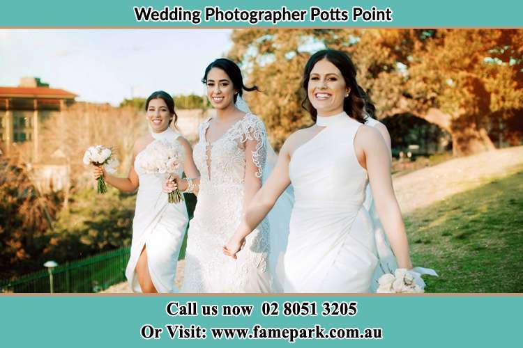 Bride and her bride's maids walking down the hill Potts Point