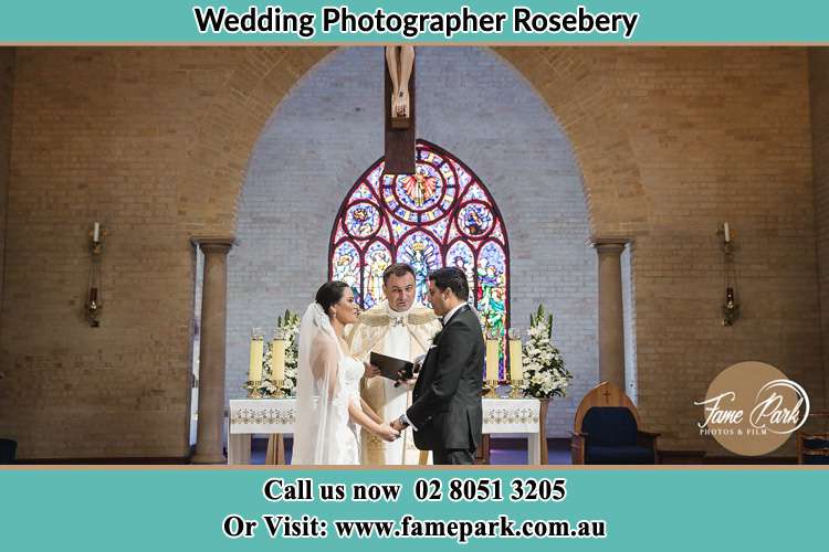 Bride and Groom with Priest at the altar Rosebery NSW 2018