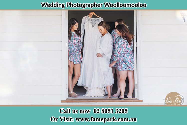 Bride looking at her gown Woolloomooloo NSW 2011